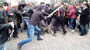 Pro-Russian protesters clash with activists supporting the territorial integrity of Ukraine as Interior Ministry members attempt to break them apart during rallies in Kharkiv